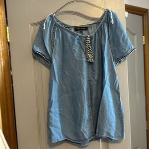 Pink tartan jean tshirt with tassel tie in front.